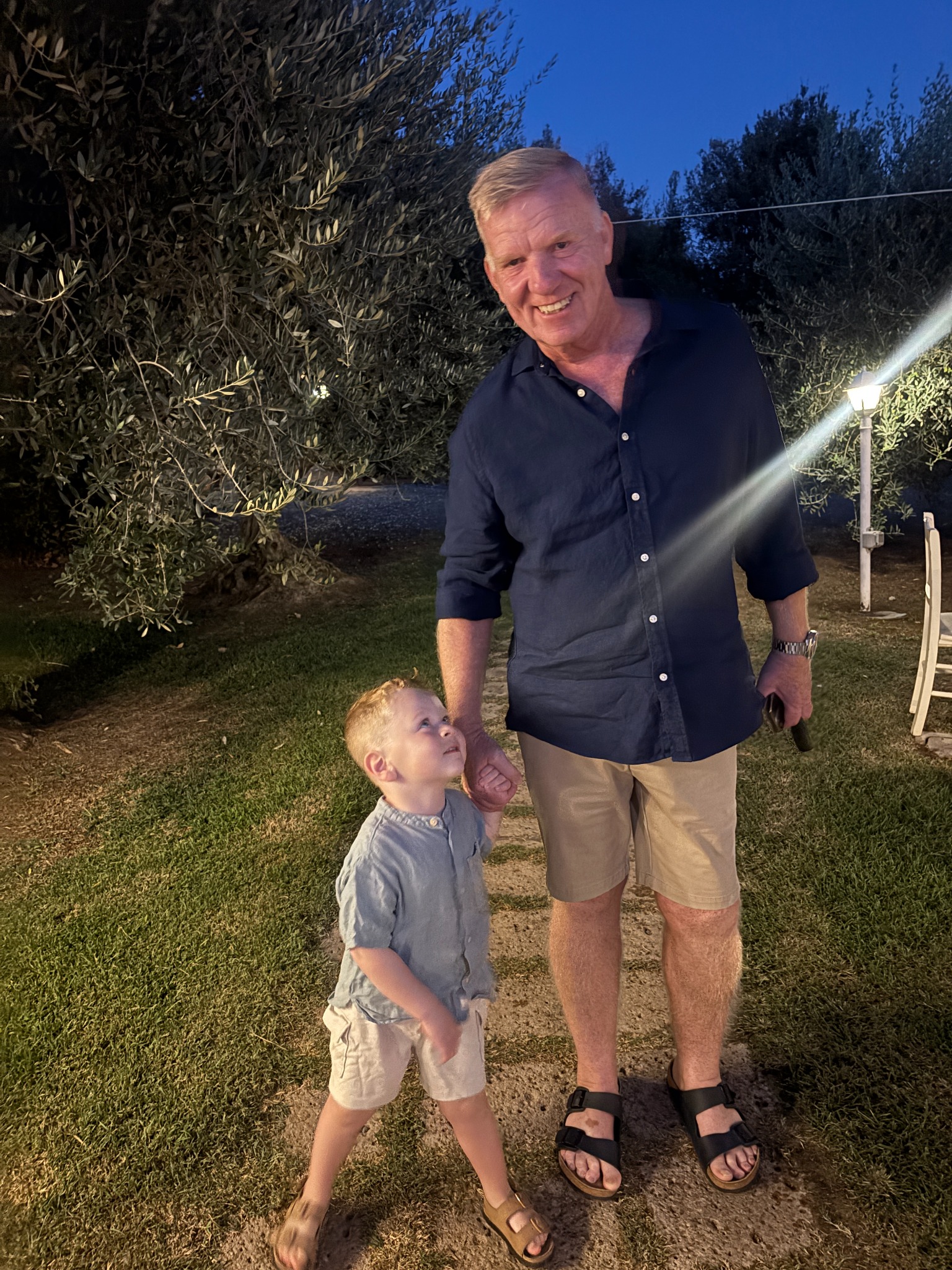 Ira holding hands with his grandad